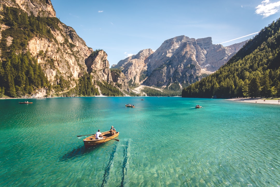 about-us three-brown-wooden-boat-on-blue-lake-water-taken-at-daytime-t7k4aepoggk